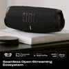 JBL Charge 5 Wi-Fi portable Bluetooth speaker in Black, on a living room shelf