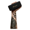 Marshall Emberton II portable Bluetooth speaker in Black and Brass, held in one hand