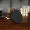 Amazon Echo Pop smart speaker in Black, on a desk