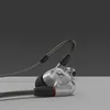 Sennheiser IE 900 wired in-ear monitors, Silver, on a grey surface