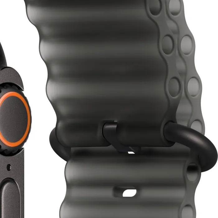 Apple Watch Ultra 4 in Black Titanium with the Translucent Black Ocean Band, close-up of the Digital Crown, side button and titanium buckle and loop