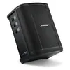 Bose S1 Pro+ portable PA system in Black, tilted back on the floor