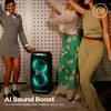 JBL PartyBox Stage 320 portable Bluetooth party speaker in Black, at a house party