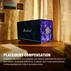 Marshall Acton III Hendrix Edition Bluetooth home speaker in Purple and Black, on a wooden desk by a window