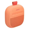Bose SoundLink Micro (2nd Gen) portable Bluetooth speaker in Sunset Peach, angled view from the right