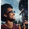 Sennheiser SoundProtex Plus reusable hearing protection earplugs in Black, worn at an outdoor concert