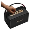 Marshall Kilburn III portable Bluetooth speaker in Black and Brass, hand turning the volume knob