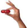 Beats Solo Buds true wireless earbuds in Transparent Red, carrying case held between two fingers