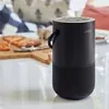 Bose Portable Smart Speaker with Alexa in Triple Black, on a kitchen counter