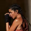 Beats Powerbeats Pro 2 true wireless earbuds in Jet Black, worn during a workout