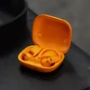 Beats Powerbeats Pro 2 true wireless earbuds in Electric Orange, earbuds in the open charging case