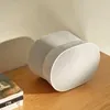 Sonos Era 300 Dolby Atmos speaker in White, on a wooden sideboard