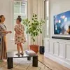 Sonos Arc Ultra Dolby Atmos soundbar in Black, on a TV console in a living room