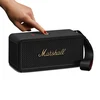 Marshall Middleton II portable Bluetooth speaker in Black and Brass, pressing the control knob