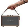 Marshall Kilburn III portable Bluetooth speaker in Brown, carried by its strap