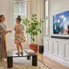 Sonos Arc Ultra Dolby Atmos soundbar in Black, on a TV console in a living room