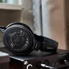Sennheiser HD 660S2 open-back audiophile headphones in Black, resting on a Sennheiser HDV 820 headphone amplifier