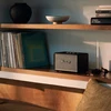 Marshall Acton III Bluetooth home speaker in Black, on a living room shelf