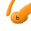 Beats Powerbeats Pro 2 true wireless earbuds in Electric Orange, close-up of the ear hook and b button