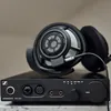 Sennheiser HD 800 S open-back audiophile headphones in Black, resting on a Sennheiser HDV 820 headphone amplifier
