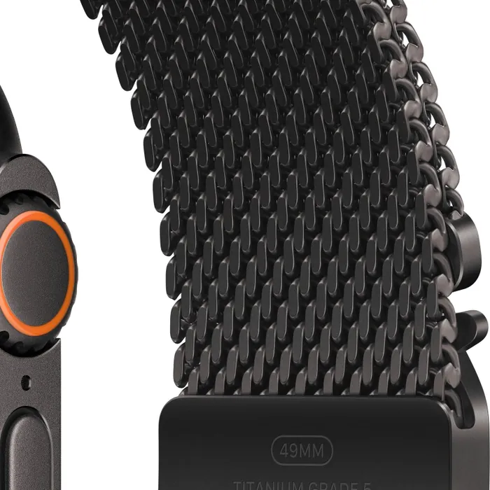 Apple Watch Ultra 4 in Black Titanium with the Black Titanium Milanese Loop, close-up of the Digital Crown, side button and titanium mesh and buckle