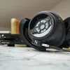 Sennheiser HD 820 closed-back audiophile headphones in Black, resting on a Sennheiser HDV 820 headphone amplifier