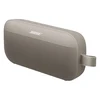 Bose SoundLink Flex (2nd Gen) portable Bluetooth speaker in Sandstone, angled view from the utility loop side
