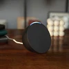 Amazon Echo Pop smart speaker in Black, on a desk
