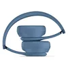 Beats Solo 4 on-ear wireless headphones in Slate Blue, folded with the ear cups stacked