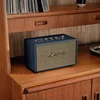 Marshall Acton III Bluetooth home speaker in Midnight Blue, on a bookshelf